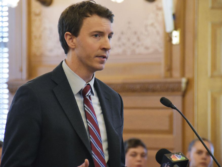 Bryan Seeley, a Major League Baseball senior vice president, testifies on a bill that would legalize sports betting in Kansas during a legislative committee hearing, Tuesday, March 13, 2018, at the Statehouse in Topeka, Kan. The league says it is neutral on bill, opposing sports betting but wanting a piece of the revenues if Kansas legalizes it. (AP Photo/Mitchell Willetts)