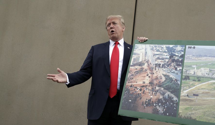 President Donald Trump speaks during a tour as he reviews border wall prototypes, Tuesday, March 13, 2018, in San Diego. (AP Photo/Evan Vucci)