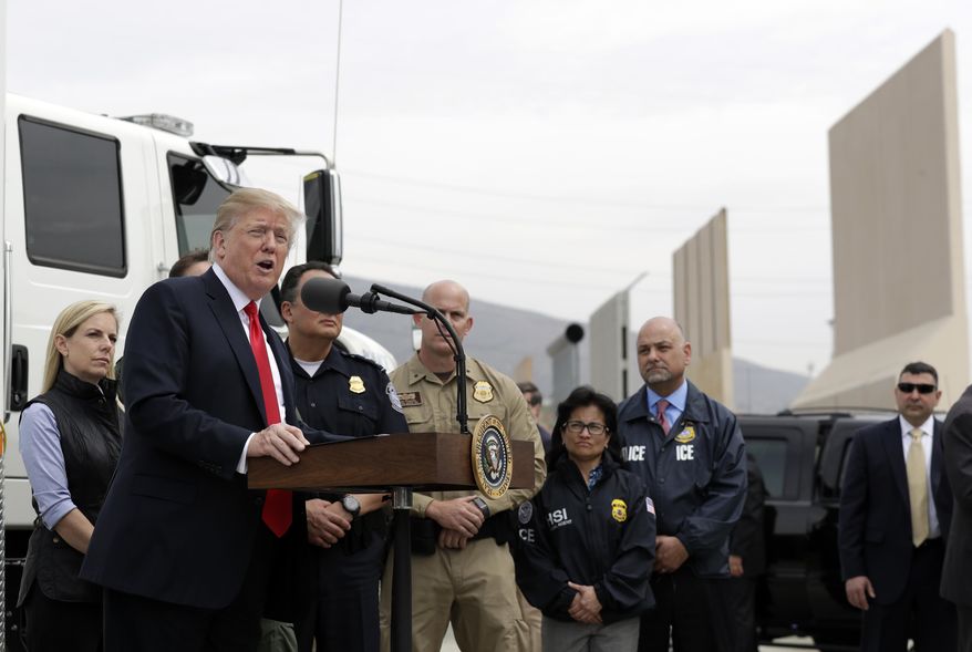 President Donald Trump speaks during a tour as he reviews border wall prototypes, Tuesday, March 13, 2018, in San Diego. (AP Photo/Evan Vucci)
