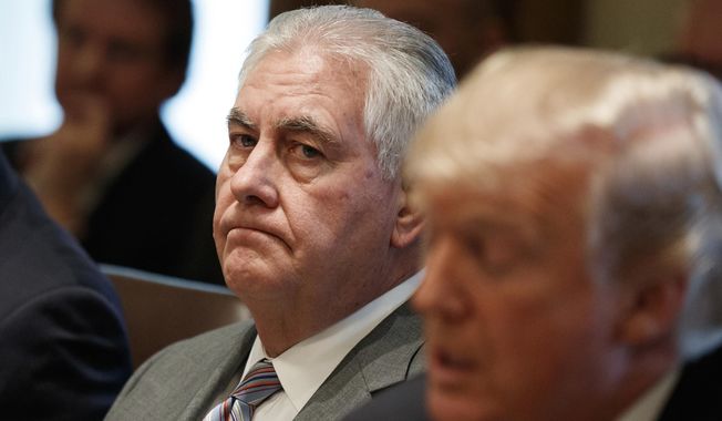 In this Jan. 10, 2018 file photo, Secretary of State Rex Tillerson listens as President Donald Trump speaks during a cabinet meeting at the White House in Washington. Tillerson is out as secretary of state. President Trump tweeted this morning that he’s naming CIA director Mike Pompeo to replace him. (AP Photo/Evan Vucci) **FILE**