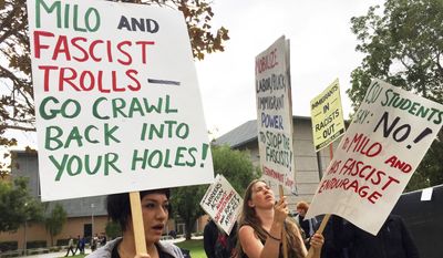 Demonstrators protest outside a speech by conservative provocateur Milo Yiannopoulos, sponsored by a Republican student group at California State University, Fullerton, Tuesday, Oct. 31, 2017. At least one fight broke out and several people were arrested. They were mostly peaceful, but one woman protesting the event attacked a Yiannopoulos supporter with punches before a third person subdued her with pepper spray. (AP Photo/Amanda Lee Myers)