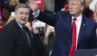 President Donald Trump, right, acknowledges the crowd during a campaign rally with Republican Rick Saccone, Saturday, March 10, 2018, in Moon Township, Pa. Saccone is running against Democrat Conor Lamb in a special election being held on March 13 for the Pennsylvania 18th Congressional District vacated by Republican Tim Murphy. (AP Photo/Keith Srakocic)