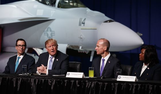 President Donald Trump speaks during a roundtable discussion on tax policy at the Boeing Company, Wednesday, March 14, 2018, in St. Louis. From left, Treasury Secretary Steve Mnuchin, Trump, Boeing CEO Dennis Muilenburg, and Boeing employee Hazel Jean Mims. (AP Photo/Evan Vucci)