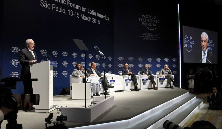 In this photo released by Brazil&#x27;s presidential press office, Brazil&#x27;s President Michel Temer, left, speaks during the opening plenary session of the World Economic Forum for Latin America, in Sao Paulo, Brazil, Wednesday, March 14, 2018. Temer says Brazil will bring the question of U.S. tariffs on steel to the World Trade Organization if it doesn&#x27;t achieve a &quot;friendly&quot; solution through negotiations.(Beto Barata/Brazil&#x27;s presidential press office via AP)
