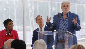 &amp;quot;Star Wars&amp;quot; creator filmmaker George Lucas, right, and his wife Mellody Hobson, left, and Don Bacigalupi, Founding President, center, attend the groundbreaking ceremony of the on his $1.5 billion Lucas Museum of Narrative Art in Los Angeles Wednesday, March 14, 2018. . The institution, scheduled to open in 2021, is envisioned as not just a repository for &amp;quot;Star Wars&amp;quot; memorabilia but a wide-ranging museum representing all forms of visual storytelling from paintings and drawings to comic strips and digital and traditional films. (AP Photo/Damian Dovarganes)