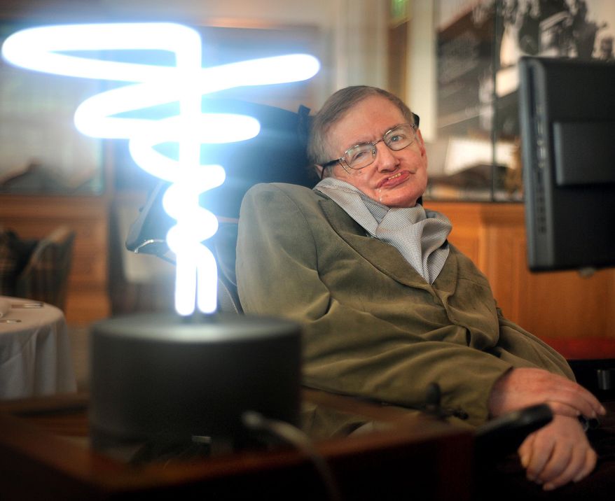 In this Feb. 25, 2012, file photo, Professor Stephen Hawking poses beside a lamp titled &quot;black hole light&quot; by inventor Mark Champkins, presented to him during his visit to the Science Museum in London. Hawking, whose brilliant mind ranged across time and space though his body was paralyzed by disease, died early Wednesday, March 18, 2018, a University of Cambridge spokesman said. He was 76. (Anthony Devlin/PA via AP)