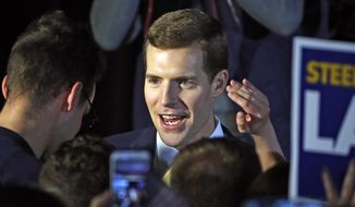 Conor Lamb, the Democratic candidate for the March 13 special election in Pennsylvania&#39;s 18th Congressional District, center, celebrates with his supporters at his election night party in Canonsburg, Pa., early Wednesday, March 14, 2018. A razor&#39;s edge separated Lamb and Republican Rick Saccone early Wednesday in their closely watched special election in Pennsylvania, where a surprisingly strong bid by first-time candidate Lamb severely tested Donald Trump&#39;s sway in a GOP stronghold. (AP Photo/Gene J. Puskar)