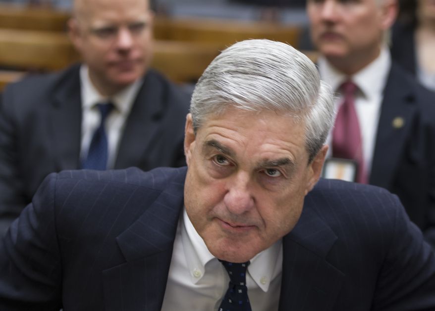 In a photo from Wednesday, May 9, 2012, then-FBI Director Robert Mueller appears before the House Judiciary Committee on Capitol Hill in Washington. (AP Photo/J. Scott Applewhite)