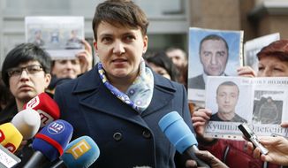 Nadiya Savchenko, the celebrated former military helicopter navigator imprisoned by Russia for months before her release in the high-profile prisoner swap, stands accused of plotting to blow up the Ukrainian parliament. (Associated Press/File)