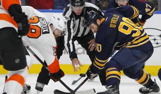 FILE - In this Jan. 10, 2017, file photo, Buffalo Sabres&#39; Ryan O&#39;Reilly (90) and Philadelphia Flyers&#39; Claude Giroux (28) face off during an NHL hockey game in Buffalo, N.Y. If Flyers captain Giroux gets throw out of the faceoff circle, Sean Couturier steps in. If Couturier gets tossed, Giroux takes the draw and wins it more often than not. “He&#39;s one of the best in the league at faceoffs,” Couturier said of Giroux, who’s ranked third in the NHL. “When you start with the puck, it&#39;s a huge part of the game.” (AP Photo/Jeffrey T. Barnes, File)