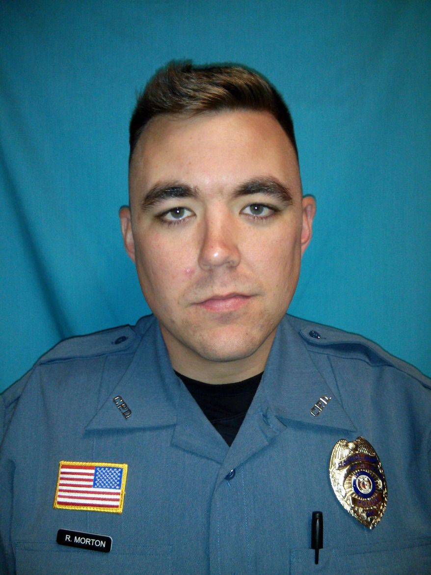 FILE - This undated file photo released by Clinton Police Department shows officer Christopher Ryan Morton. Tammy Dee Widger was charged Wednesday, March 14, 2018, with second-degree murder in the shooting death of Morton. Her rental home was the site of the fatal shooting on March 6. Prosecutors say the murder charge was added because Morton was killed as a result of Widger's drug crime. (Clinton Police Department via AP, File)