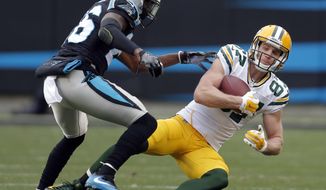 FILE - In this Dec. 17, 2017, file photo, Green Bay Packers&#39; Jordy Nelson (87) catches a pass in front of Carolina Panthers&#39; Daryl Worley (26) during the second half of an NFL football game in Charlotte, N.C. The Oakland Raiders are shuffling wide receivers, signing free agent Nelson and releasing Michael Crabtree. A person familiar with the moves says Nelson has agreed to a two-year contract on Thursday, March 15, 2018, after spending more than a day meeting with the former Packers star. (AP Photo/Bob Leverone, File)