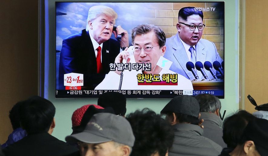 FILE - In this March 7, 2018, file photo, people watch a TV screen showing images of North Korean leader Kim Jong Un, right, South Korean President Moon Jae-in, center, and U.S. President Donald Trump at the Seoul Railway Station in Seoul, South Korea. South Korean President Moon Jae-in has always wanted to lead the diplomacy aimed at ending the North Korean nuclear crisis, even as he was overshadowed in his first year in office by a belligerent standoff between Donald Trump and Kim Jong Un. Korean letters on the screen read: &amp;quot;Thawing Korean Peninsula.&amp;quot; (AP Photo/Ahn Young-joon, File)