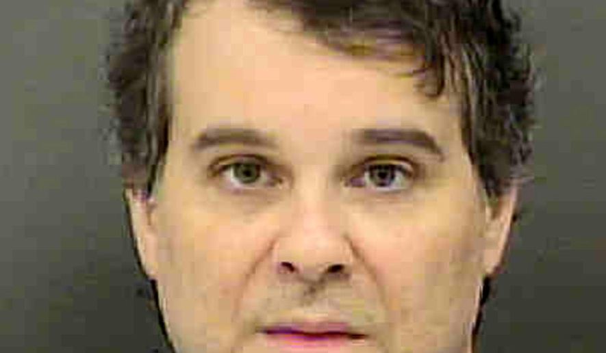 This March 15, 2018 photo provided by the Mecklenburg County Sheriff's Office shows Christian McCall at the Mecklenburg County jail in North Carolina. McCall, a banker suspected of killing a police officer and wounding three others after a domestic dispute two months ago, spent eight years in the Army and had a successful professional career making nearly $86,000 a year. The burst of unusual violence stunned family, who said they didn't see any signs of looming problems or a violent breakdown. (Charlotte Mecklenburg Police Department via AP)
