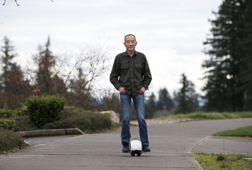 Camas-based inventor Shane Chen says he barely saw any profits from the hover board craze he helped start in 2015 with his invention, the Hovertrax. Knockoffs flooded the market and a typo in his patent later foiled attempts to sue. Here he demonstrates his latest invention, the IOTATrax, that he hopes to better protect, outside his office at Inventist in Camas, Wash., on Monday, March 5, 2018. (Alisha Jucevic/The Columbian via AP)