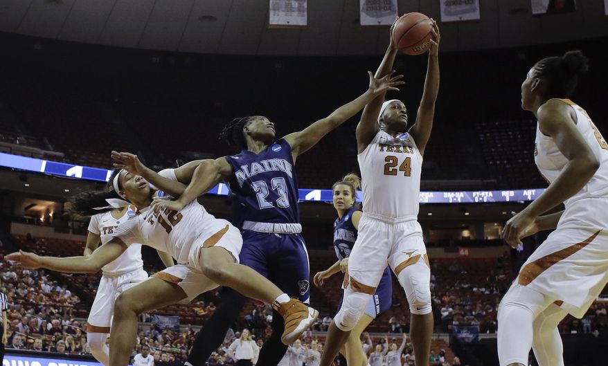 Texas forward Joyner Holmes (24) grabs a rebound over Maine guard Tanesha Sutton (23) and teammate Jada Underwood (12) during a first-round game in the NCAA women's college basketball tournament, Saturday, March 17, 2018, in Austin, Texas. (AP Photo/Eric Gay)