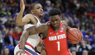 Ohio State forward Jae&#39;Sean Tate, right, tries to drive around Gonzaga guard Zach Norvell Jr. during the first half of a second-round game in the NCAA men&#39;s college basketball tournament Saturday, March 17, 2018, in Boise, Idaho. (AP Photo/Otto Kitsinger)