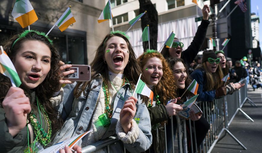 Spectators cheer as they take part in the St. Patrick&#x27;s Day parade Saturday, March 17, 2018, in New York. Several bagpipe bands led a parade made up of over 100 marching bands after Democratic Gov. Andrew Cuomo spoke briefly, calling it a &amp;quot;day of inclusion&amp;quot; and adding: &amp;quot;We&#x27;re all immigrants.&amp;quot;  (AP Photo/Craig Ruttle)
