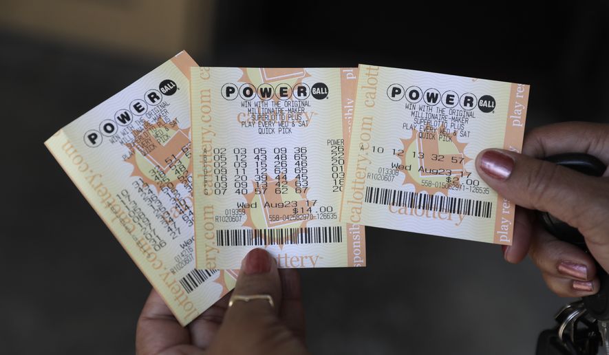 Powerball tickets are shown outside of a a liquor store Wednesday, Aug. 23, 2017, in Fremont, Calif. Officials estimated jackpot for Wednesday night&#x27;s Powerball lottery game has climbed to $700 million, making it the second largest in U.S. history. (AP Photo/Marcio Jose Sanchez)