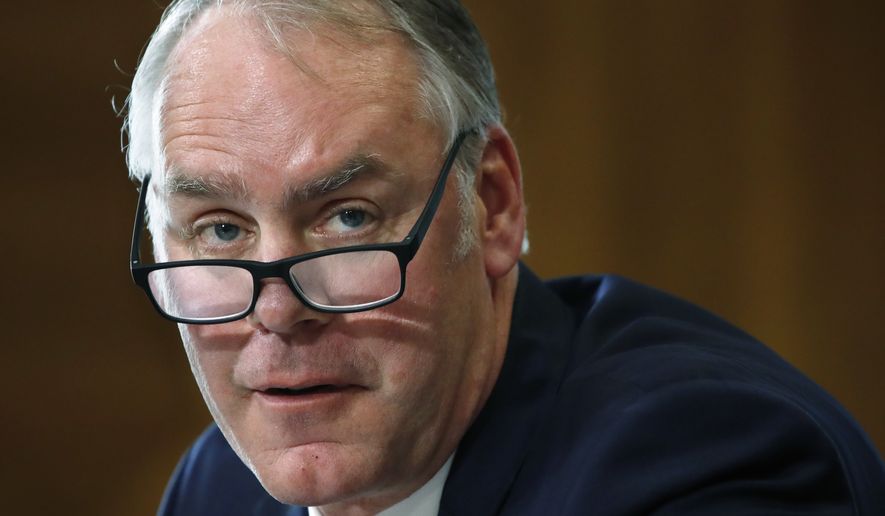 FILE - In this file photo from March 13, 2018, Interior Secretary Ryan Zinke testifies before the Senate Committee on Energy and Natural Resources on Capitol Hill in Washington. Zinke is drawing criticism for his use of a Japanese greeting when responding to a question from a congresswoman of Japanese descent during a hearing on March 15, 2018.( File AP Photo/Jacquelyn Martin)