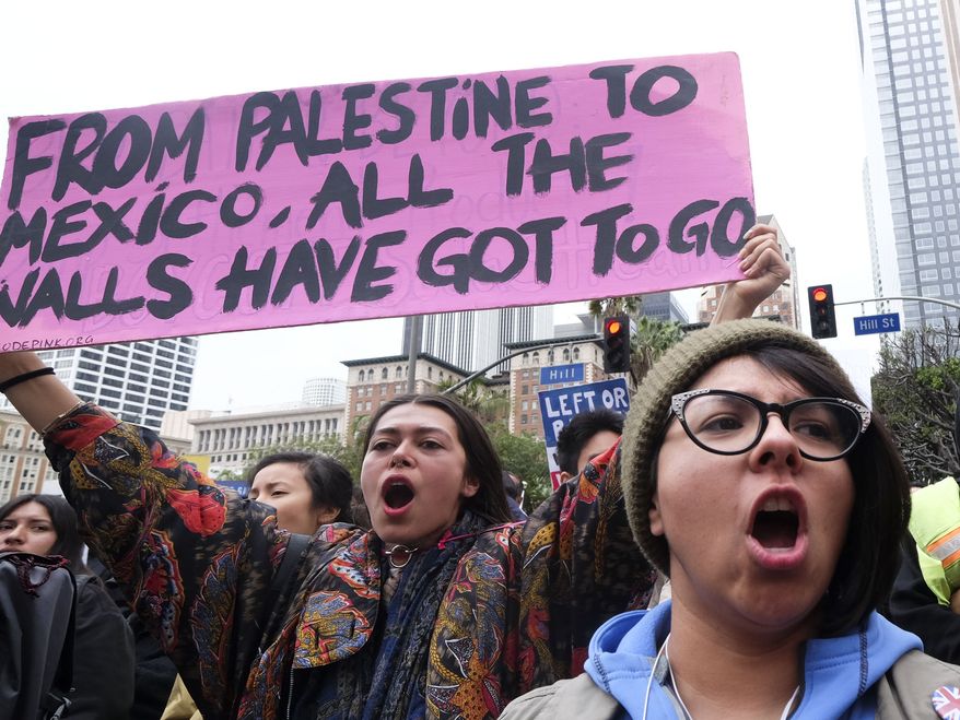Thousands of people take part in the ``Free the People Immigration March,'' to protest actions taken by President Donald Trump and his administration, in Los Angeles Sunday, Feb. 18, 2017. March and rally organizers are calling for an end to ICE raids and deportations, minority killings by police and that health care be provided for documented and undocumented individuals. Immigrant, faith, labor and community groups are expected to attend, calling for sanctuary to be given to immigrants.. (AP Photo/Ringo H.W. Chiu)