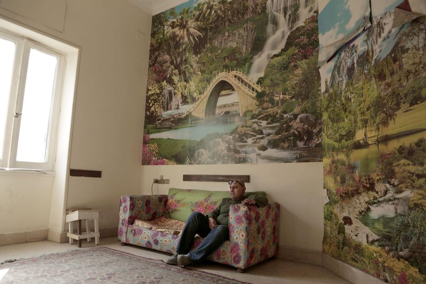 In this Wednesday, March 14, 2018 photo, Egyptian director Ahmed El Attar, sits in a room at his office in Cairo, Egypt. State censors have banned a play, that is part of the Downtown Contemporary Arts Festival, the day of its Cairo premiere, saying it could not be shown without the removal of five scenes. As a result El Attar cancelled two showings of Before the Revolution, a two-actor piece that depicts oppression and stagnation in Egypt before its 2011 popular uprising. (AP Photo/Nariman El-Mofty)