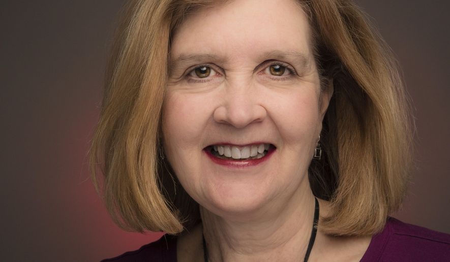 Associated Press journalist Nancy Benac is photographed in the news agency's Washington bureau, Friday, March 16, 2018. The Associated Press has named Nancy Benac as its White House news editor. Benac is a veteran Washington journalist who has covered the presidency and national political campaigns. The appointment was announced Monday by Julie Pace, AP’s Washington bureau chief. (AP Photo/J. David Ake)