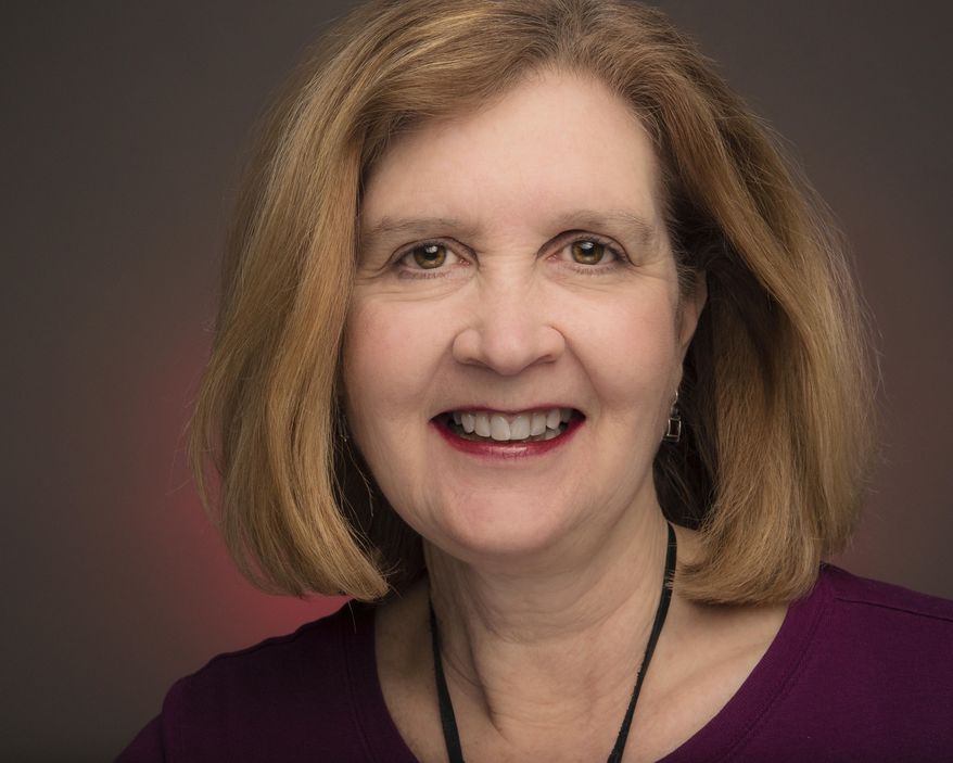 Associated Press journalist Nancy Benac is photographed in the news agency's Washington bureau, Friday, March 16, 2018. The Associated Press has named Nancy Benac as its White House news editor. Benac is a veteran Washington journalist who has covered the presidency and national political campaigns. The appointment was announced Monday by Julie Pace, AP’s Washington bureau chief. (AP Photo/J. David Ake)