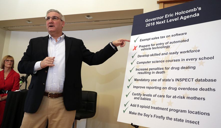 Indiana Gov. Eric Holcomb outlines his goals for a special session of the legislature during a press conference in Indianapolis, Monday, March 19, 2018. (AP Photo/Michael Conroy)