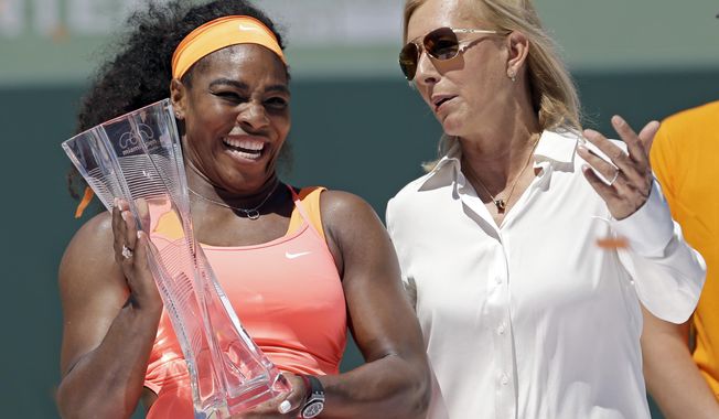 FILE - This is a Saturday, April 4, 2015, file photo of former tennis star Martina Navratilova, right,  as she poses with Serena Williams, after Williams won the women&#x27;s final match at the Miami Open tennis tournament, in Key Biscayne, Fla. Martina Navratilova says she is &amp;quot;angry&amp;quot; and feels let down by the BBC after learning that John McEnroe gets paid at least 10 times more than her for their broadcasting roles at Wimbledon. McEnroe earns between 150,000-199,999 pounds ($210,000-280,000) for working at Wimbledon while Navratilova says she gets paid 15,000 pounds ($21,000). The BBC says Navratilova appears on fewer broadcasts and is on a different type of contract than McEnroe. (AP Photo/Alan Diaz/File)