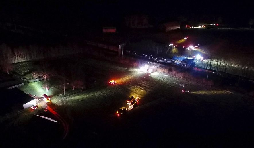 This photo provided by Nicholas Waun shows the scene where two trains collided and derailed in Georgetown, Ky., early Monday, March 19, 2018. Four people were injured after the accident late Sunday night. (Nicholas Waun via AP)