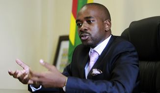 In this Thursday, March 8, 2018 photo, the leader of MDC-T, Zimbabwe&#39;s biggest opposition party, Nelson Chamisa gestures during an interview with the Associated Press in Harare.  Ahead of Zimbabwe&#39;s crucial elections this year, the biggest opposition party has selected a charismatic lawyer and pastor to challenge the military-backed president in the first vote without former leader Robert Mugabe in decades. (AP Photo/Tsvangirayi Mukwazhi)