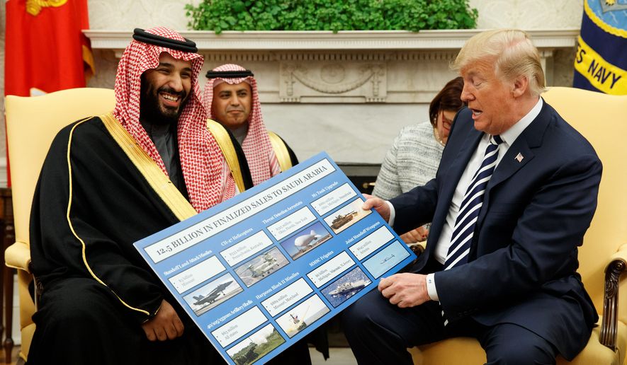 President Trump shows a chart highlighting arms sales to Saudi Arabia during a meeting with Saudi Crown Prince Mohammed bin Salman on Tuesday. (ASSOCIATED PRESS)