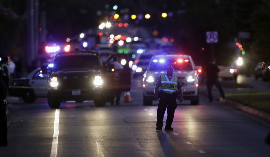 Emergency vehicles stage near the site of another explosion, Tuesday, March 20, 2018, in Austin, Texas. (AP Photo/Eric Gay)