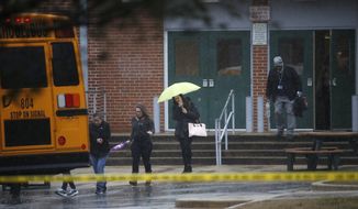 Teachers and school employees depart Great Mills High School, the scene of a shooting, Tuesday, March 20, 2018 in Great Mills, Md.  A teenager wounded a girl and a boy inside his Maryland high school Tuesday before an armed school resource officer was able to intervene, and each of them fired one more round as the shooter was fatally wounded, a sheriff said.  St. Mary&#39;s County Sheriff Tim Cameron said the student with the handgun was declared dead at a hospital, and the other two students were in critical condition. He said the officer was not harmed.  (AP Photo/Alex Brandon)