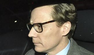 Chief Executive of Cambridge Analytica (CA) Alexander Nix, leaves the offices in central London, Tuesday March 20, 2018.  Cambridge Analytica, has been accused of improperly using information from more than 50 million Facebook accounts. It denies wrongdoing. (Dominic Lipinski/PA via AP)