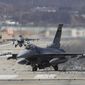 U.S. Air Force F-16 fighter jets land at the Osan U.S. Air Base in Pyeongtaek, South Korea, Tuesday, March 20, 2018. At a potentially pivotal moment of diplomacy with North Korea, the Pentagon said Monday that annual U.S.-South Korean military exercises that had been postponed for the Pyeongchang Winter Olympics will begin April 1. (Hong Gi-won/Yonhap via AP)