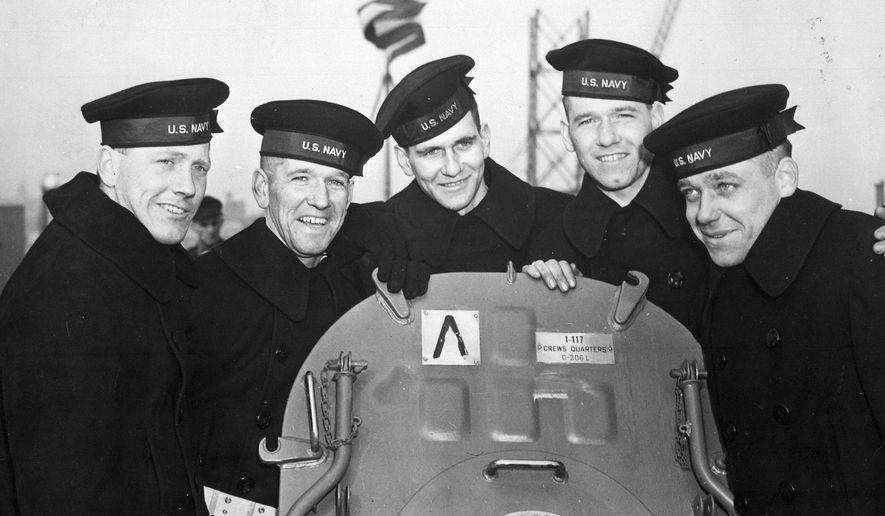 This Feb. 14, 1942 photo provided by the U.S. National Archives shows the five Sullivan brothers on board USS Juneau (CL-52) at the time of her commissioning ceremonies at the New York Navy Yard. The brothers who were all killed in the World War II sinking of the USS Juneau on Nov. 13, 1942. From left to right: Joseph, Francis, Albert, Madison and George Sullivan. Wreckage from the USS Juneau, a Navy ship sunk by the Japanese 76 years ago, has been found in the South Pacific. (U.S. National Archives via AP)