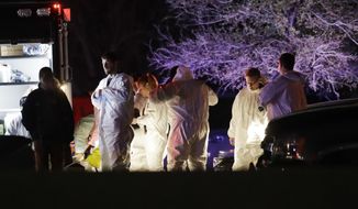 Members of law enforcement stage near the area where a suspect in a series of bombing attacks in Austin blew himself up as authorities closed in, Wednesday, March 21, 2018, in Round Rock, Texas. (AP Photo/Eric Gay)
