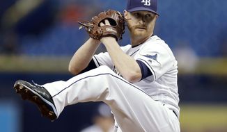 FILE - In this Sept. 4, 2017, file photo, Tampa Bay Rays&#39; Alex Cobb goes into his windup during the first inning of a baseball game against the Minnesota Twins in St. Petersburg, Fla.  Cobb, a free agent, and the Baltimore Orioles have finalized a four-year contract. The 30-year-old righty was 12-10 with a 3.66 ERA in 29 starts for Tampa Bay last season. (AP Photo/Chris O&#39;Meara, File)