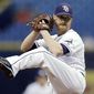 FILE - In this Sept. 4, 2017, file photo, Tampa Bay Rays&#39; Alex Cobb goes into his windup during the first inning of a baseball game against the Minnesota Twins in St. Petersburg, Fla.  Cobb, a free agent, and the Baltimore Orioles have finalized a four-year contract. The 30-year-old righty was 12-10 with a 3.66 ERA in 29 starts for Tampa Bay last season. (AP Photo/Chris O&#39;Meara, File)