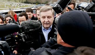 In this Tuesday, March 13, 2018, file photo, Republican Rick Saccone, center, is surrounded by media as he heads to a polling place in McKeesport, Pa., to cast his ballot in a special U.S. House election. Saccone lost the election to Democrat Conor Lamb. (AP Photo/Keith Srakocic, File)