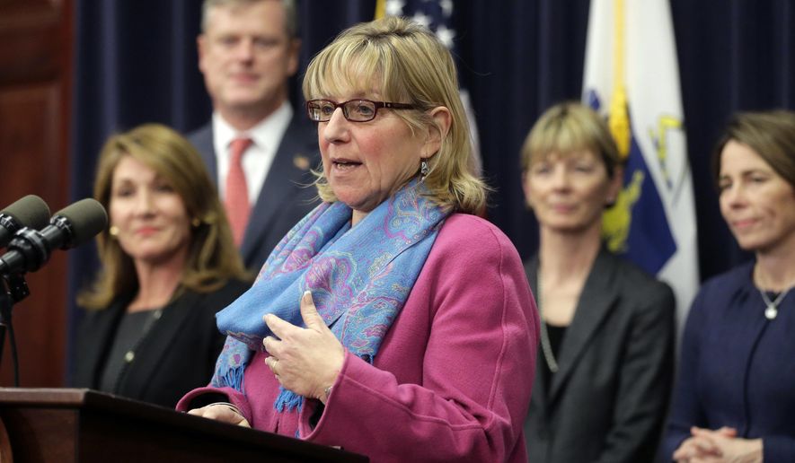 FILE - In this Jan. 25, 2016 file photo, Massachusetts Senate Ways and Means Chair Karen Spilka, center, speaks at the Statehouse, in Boston, surrounded by Lt. Gov. Karyn Polito, left, Gov. Charlie Baker, second from left, state Secretary of Health and Human Services Marylou Sudders, second from right, and state Attorney General Maura Healey, right. Spilka said Wednesday, March 21, 2018, she had secured commitments from enough of her colleagues to become the next president of the Massachusetts Senate. (AP Photo/Steven Senne, File)
