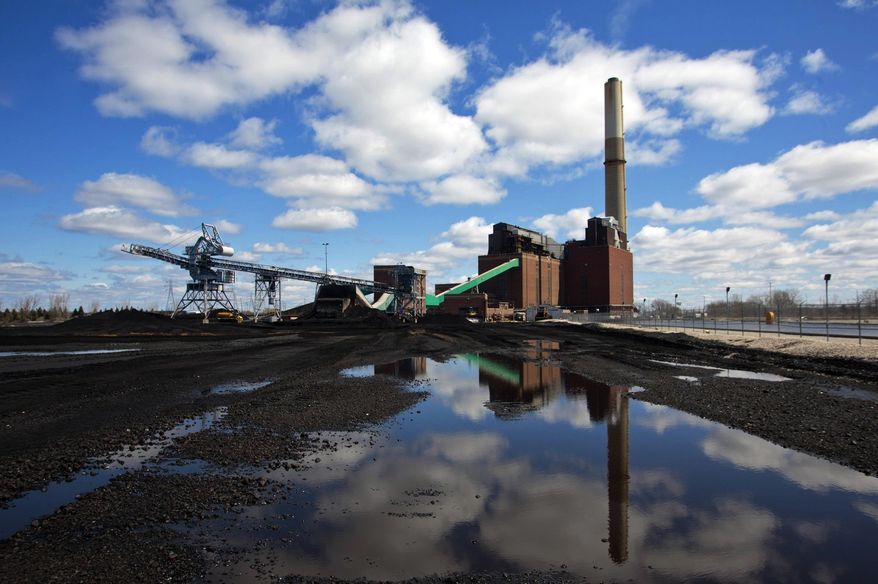 FILE - This April 12, 2016 file photo shows the coal-fired B.C. Cobb Plant generating station in Muskegon, Mich., which closed April 15, 2016. The global fleet of coal-fired power plants is projected to begin shrinking by 2022 as plant retirements outpace new construction, according to a new report that warns the heavily-polluting fuel's decline may not come quickly enough to meet international emission reduction goals. (Joel Bissell//Muskegon Chronicle via AP, File)