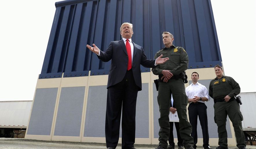 President Trump reviews prototypes for his proposed border wall constructed outside San Diego, California, shown here earlier this month with Rodney Scott, the Border Patrol&#x27;s San Diego sector chief. (Associated Press)