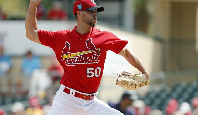 FILE- In this March 1, 2018, file photo, St. Louis Cardinals starting pitcher Adam Wainwright throws during the first inning of an exhibition spring training baseball game against the Minnesota Twins in Jupiter, Fla. Wainwright believes he can still be the best pitcher in all of baseball, even at 36 years old and coming off an injury-riddled 2017 season that was the worst of his illustrious career. (AP Photo/Jeff Roberson, File)