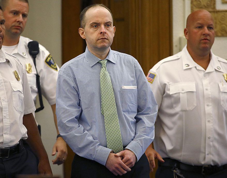 FILE - In this July 21, 2015 photo, officers lead Radoslaw Czerkawski into court for sentencing in Dedham, Mass., after he was convicted of larceny. Closing arguments are scheduled to begin Thursday, March 22, 2018, in the trial of Czerkawski, a Massachusetts man accused of abusing a dog so severely that it had to be euthanized. (Greg Derr/The Quincy Patriot Ledger via AP, File)