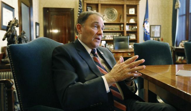 FILE - In this March 8, 2018, file photo, Utah Gov. Gary Herbert speaks during an interview at the Utah state Capitol, in Salt Lake City. Herbert says he isn't sure yet whether he'll be calling lawmakers into a special session this year to address gun violence and school shootings as some lawmakers have suggested. Herbert said at his monthly televised news conference at KUED Thursday, March 22 that he wouldn't plan to call a special session unless there's consensus on ideas that are "not just a feel good thing " but will make concrete improvements. (AP Photo/Rick Bowmer, File)
