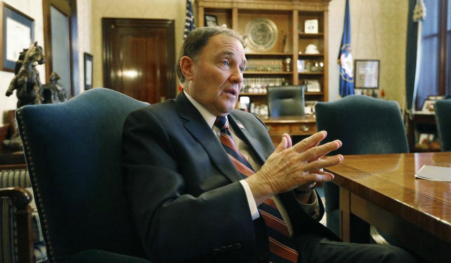 FILE - In this March 8, 2018, file photo, Utah Gov. Gary Herbert speaks during an interview at the Utah state Capitol, in Salt Lake City. Herbert says he isn't sure yet whether he'll be calling lawmakers into a special session this year to address gun violence and school shootings as some lawmakers have suggested. Herbert said at his monthly televised news conference at KUED Thursday, March 22 that he wouldn't plan to call a special session unless there's consensus on ideas that are "not just a feel good thing " but will make concrete improvements. (AP Photo/Rick Bowmer, File)