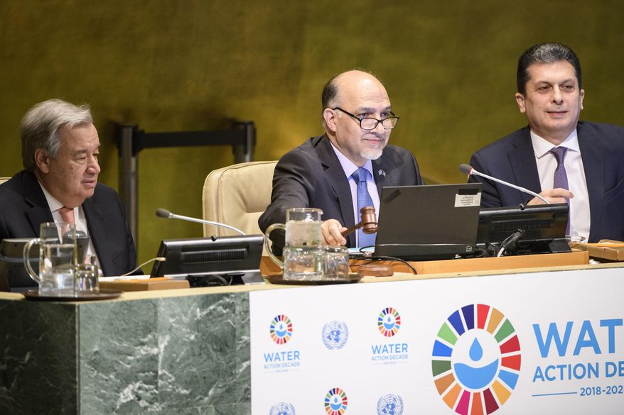 Afghanistan's United Nations ambassador Mahmoud Saikal, center, speaks in the General Assembly for the launch of the International Decade for Action on Water for Sustainable Development, Thursday, March 22, 2018, at U.N. headquarters. Sitting also are, Secretary-General António Guterres, left, and Movses Abelian, right, an assistant secretary-general. (Manuel Elias/United Nations via AP)